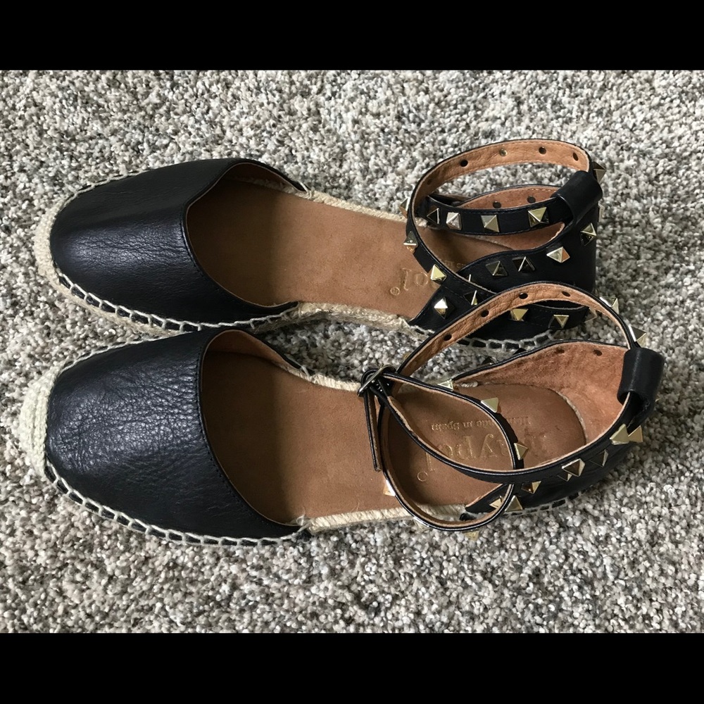 Black and gold-studded Espadrilles.